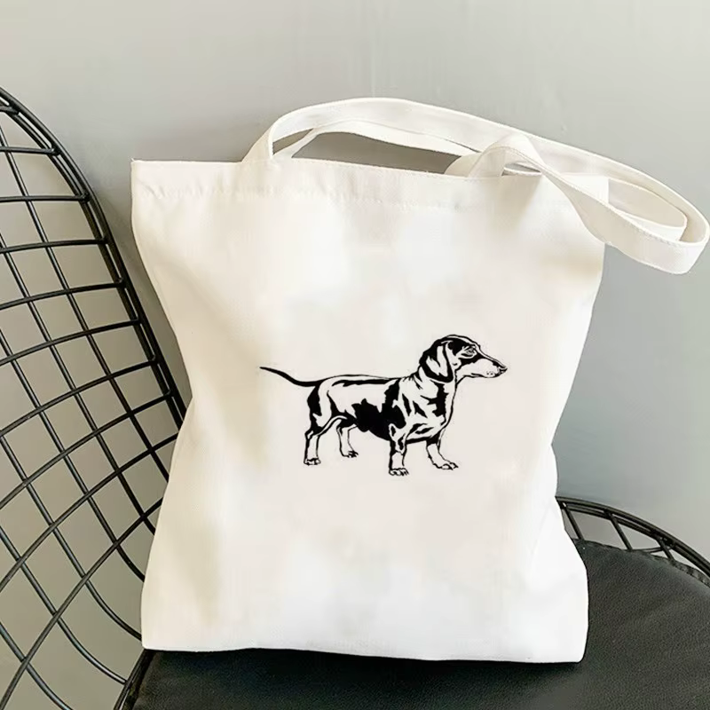 Light canvas tote with a black dachshund drawing
